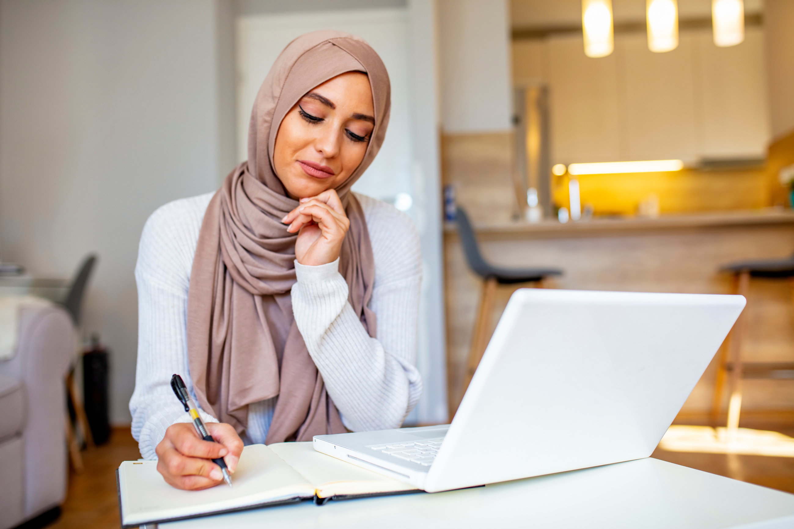 Muslim woman working with computer.